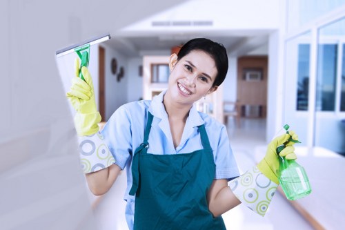 Cleaner preparing a living room in an SW11 terrace house