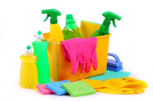 Turnover cleaning team preparing an Airbnb bedroom in SW11